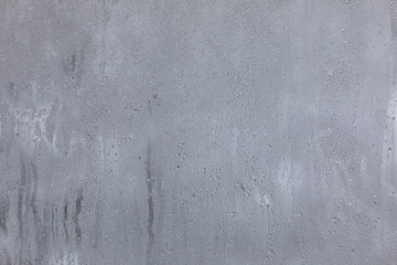 The texture of fogged glass in a warm room