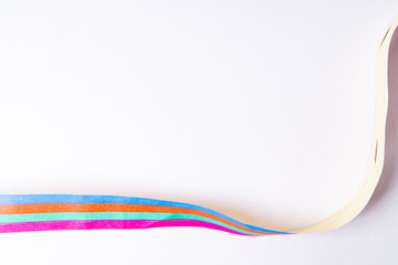 A paper streamer laying on white background