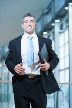 Smiling Businessman Runs Towards Camera