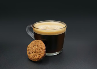 Cup of coffee and chocolate chip cookies. Symbolic image.