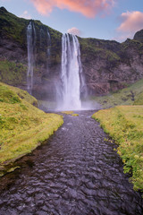 Icelandic waterfall at sunset 