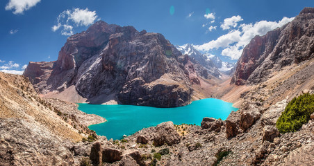 Tajikistan, beautiful panorama from the rock to Great Allo lake among Fan mountains. Hiking by ...