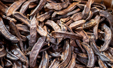 Carob food is sweet and healthy. Photographed in dried fruits store.