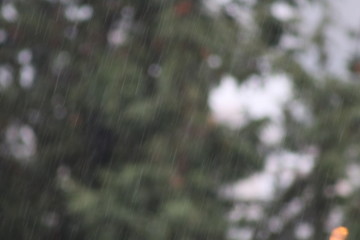 Rainy day in Crete. Falling rain and reflecting drops hanging from outdoor washing lines and rusting metal rods.