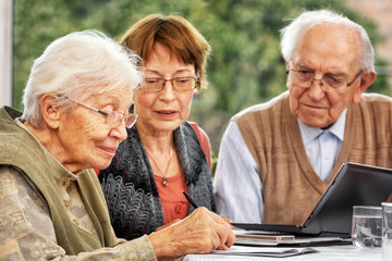 Elderly Woman Signing a Contract
