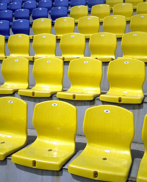 Empty yellow and blue seats at the stadium
