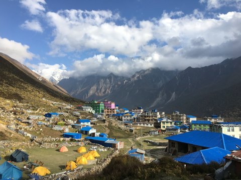Overlook view of mountain town in the Himalayas with clouds