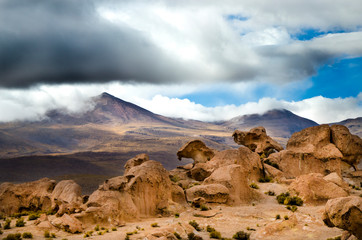 Interesting rock formations against mountains in Bolivia