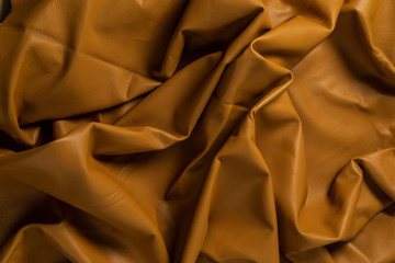 Texture cuir jaune moutarde plissé