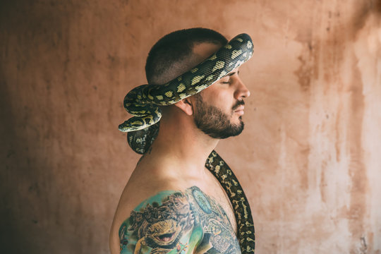 snake surrounding man's head