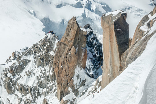 Mont Blanc's famous Cosmiques Ridge on a sunny day, climber traffic