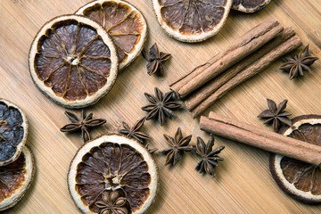 Dried citrus fruits with cinnamon, star anise on white background. Mulled Wine Ingredients.