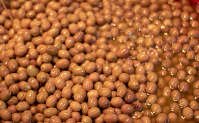 Olives of yellow color. Photographed in front of the supermarket.