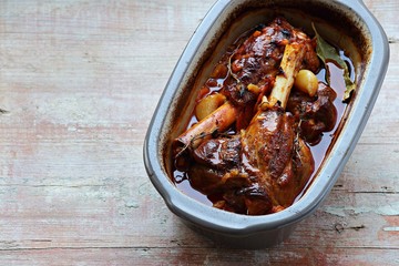 Slow cooked lamb shanks with herbs and spices. Copy space