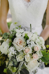 wedding bouquet in brides hands of bride