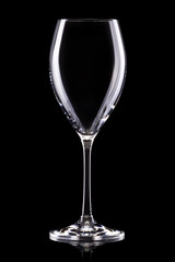 Empty red wine glass isolated on a black background
