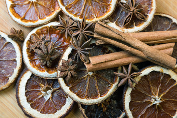 Dried citrus fruits with cinnamon, star anise on white background. Mulled Wine Ingredients.
