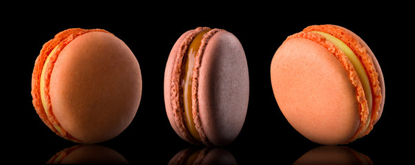 Set of colorful macaroons isolated on black background