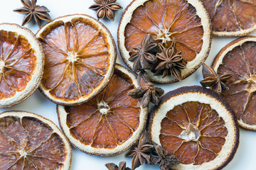 Dried citrus fruits with cinnamon, star anise on white background. Mulled Wine Ingredients.