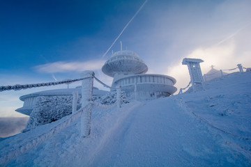 peak of Sniezka mountain in Giant Mountains in Poland and Czech republic border during winter