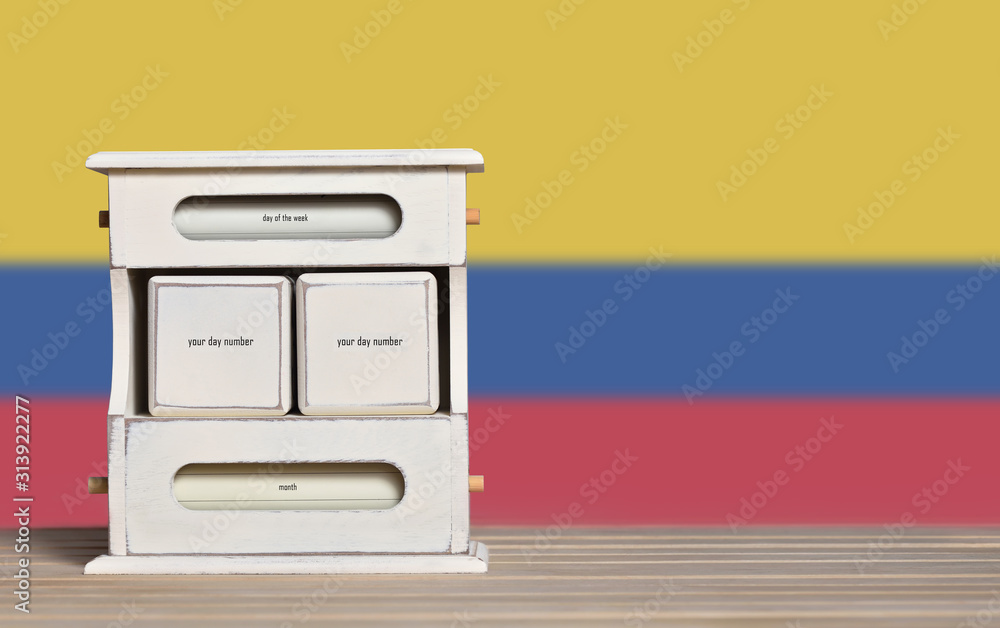 Poster wooden retro calendar with free space for a date on the background of the flag of colombia. template