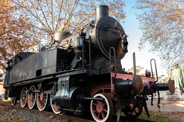 Fototapeta na wymiar old steam locomotive on rail on display