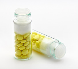 Valerian root extract, herbal pills, tablets in a glass bottle. Medicinal product for sedation, natural herbs for relaxing the nervous system. Health care and good sleep.