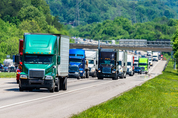 Green 18-Wheeler Leads Heavy Highway Traffic
