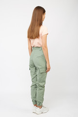 girl in green cargo pants and a t-shirt