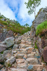 Fototapeta na wymiar Stone steps of a hiking trail to the Preikestolen in Rogaland county.Norway