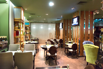 Fototapeta na wymiar Interior of cozy modern style restaurant