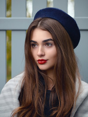 Close Up mood cloudy day portrait young elegant french style brown haired woman with red lips in...