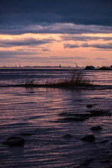 The shore of the Gulf of Finland in winter at sunset in Lakhta, St. Petersburg
