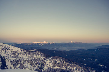 Spectacular winter mountain panoramic view of mountains at sunset.