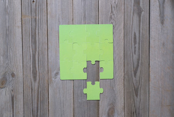 colored puzzle on wooden boards team business concept