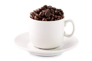 Coffee beans in a white cup on a saucer isolated on white background
