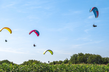 Paragliders over Longues-sur-Mer, Normandy