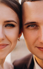 Beautiful newlyweds are smiling. Wedding idea. Wedding faces. Wedding photography. Half face.