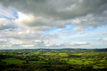 Fototapeta na wymiar Panoramic view of rolling green English patchwork countryside in Devon, UK