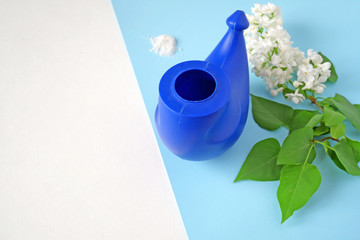 device for nasal hygiene and lilac flower bunch with copy space, neti pot and flowers, device for...