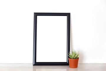 Black square empty frame and cactus on marble background