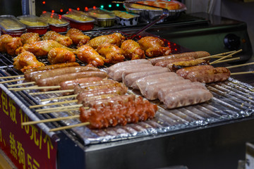 Chinese street food. Street trading. Chinese kinds of fresh seafood at an asian seafood market in Sanya, Hainan province, China. Inscription: name food.