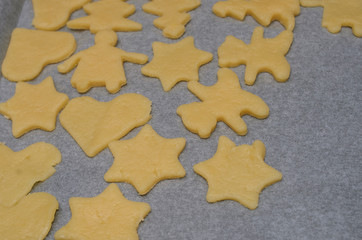 Fototapeta premium Dough cookies lie on a tray before baking