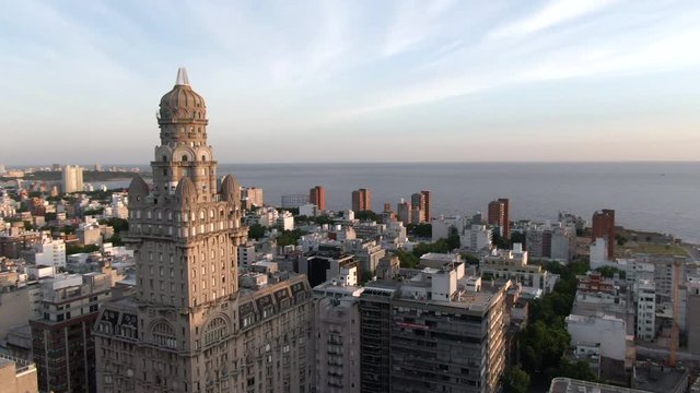Montevideo, Uruguay, aerial view of cityscape showing architectural landmark Palacio Salvo in the Old City at sunset. 