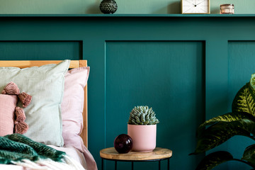 Modern bedroom interior with design coffee table, succulent, plant and elegant personal...