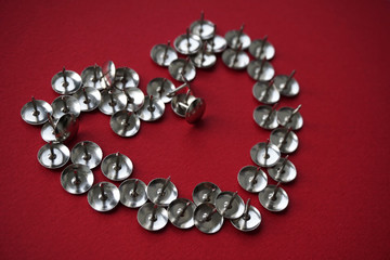 Heart shape on red background with stationery buttons.