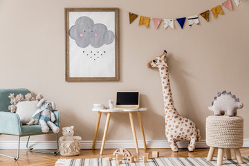 Stylish and beige scandinavian decor of kid room with mock up poster frame,  design furnitures, natural toys, hanging colorful flags, plush animal and child accessories and teddy bears. Home decor.