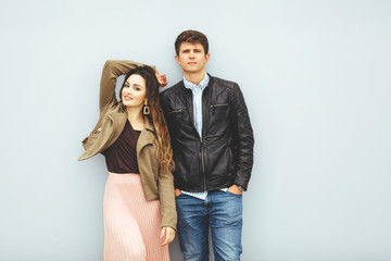 Happy loving couple isolated on gray background. stylish image, good mood, kiss in love