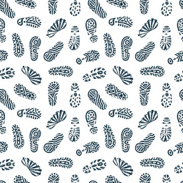 Grunge footprints Seamless pattern. Hand drawn doodles shoe tracks - Vector illustration. Black and white background.
