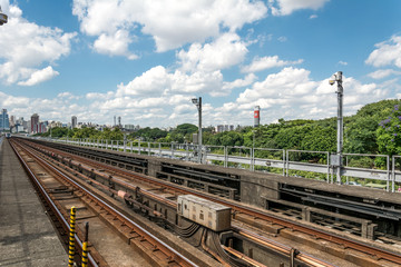 Urban train rail in Sao Paulo, Brazil, with buildings at the backside. Urban train rail, with buildings at the backside.